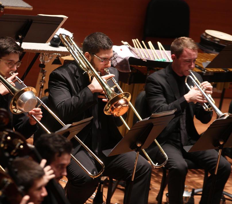 Brass section performing in the orchestra